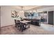 Open-concept dining area with pendant lighting and seamlessly flowing into kitchen at 9556 W 89Th Cir, Broomfield, CO 80021