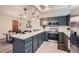 Well-lit kitchen with modern appliances, countertops, and pendant lighting at 9556 W 89Th Cir, Broomfield, CO 80021