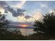 Scenic view of a sunset over the lake, emphasizing the tranquil and natural surroundings at 9556 W 89Th Cir, Broomfield, CO 80021