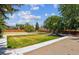 Well-maintained community playground with grassy area, picnic tables, and play equipment for children at 9556 W 89Th Cir, Broomfield, CO 80021