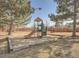 Community playground featuring a slide and climbing structure, perfect for outdoor activities at 9556 W 89Th Cir, Broomfield, CO 80021