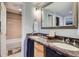 Bathroom features a marble countertop with dual sinks and shower with a tub at 1777 Larimer St # 1203, Denver, CO 80202