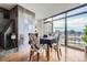 Dining area with city views, tile fireplace, and a table with seating for four at 1777 Larimer St # 1203, Denver, CO 80202