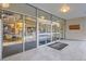 Building entrance with automatic doors provides residents access to the building at 1777 Larimer St # 1203, Denver, CO 80202