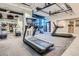 Community gym is equipped with treadmills and views of the city skyline at 1777 Larimer St # 1203, Denver, CO 80202