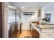 Modern kitchen featuring stainless steel appliances, granite countertops, and dark wood cabinetry at 1777 Larimer St # 1203, Denver, CO 80202