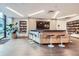 Community library with a television, bookcase and modern furniture at 1777 Larimer St # 1203, Denver, CO 80202