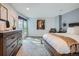Bright main bedroom with an exterior balcony and light-colored walls at 1777 Larimer St # 1203, Denver, CO 80202