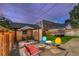 Patio and backyard with seating and mature trees at 1172 Harrison St, Denver, CO 80206