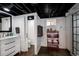 Modern bathroom with red storage shelves, sleek fixtures, and shower at 1172 Harrison St, Denver, CO 80206