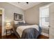 Cozy bedroom with hardwood floors, minimalist decor, and natural light at 1172 Harrison St, Denver, CO 80206