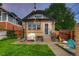 Exterior view of home with covered grill, grass, and patio at 1172 Harrison St, Denver, CO 80206
