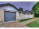 A brick garage complements a beautiful home with a privacy fence and a well-kept lawn at 1172 Harrison St, Denver, CO 80206