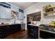 Stylish kitchen featuring unique cabinetry, stainless steel appliances, and a functional layout at 1172 Harrison St, Denver, CO 80206