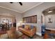Cozy living room featuring hardwood floors, a comfortable leather couch, and artwork at 1172 Harrison St, Denver, CO 80206