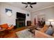 Inviting living room with a fireplace, wood floors, and a comfortable seating area at 1172 Harrison St, Denver, CO 80206