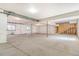 Unfinished basement area with cement flooring, support beams, and a framed in stairwell to the right at 497 Valley Way, Bennett, CO 80102