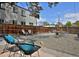 Cozy backyard features a gravel patio, a sturdy fence, and ample seating at 2424 N Clay St, Denver, CO 80211