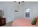 Bedroom with plush carpet, bright window, and traditional style at 2424 N Clay St, Denver, CO 80211