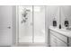 Modern bathroom showcases a glass-enclosed shower and sleek vanity with ample counter space at 23652 E 40Th Ave, Aurora, CO 80019