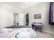 This bedroom offers open closet space and features a built-in desk at 23652 E 40Th Ave, Aurora, CO 80019
