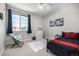 This bedroom features neutral colors and a comfy sitting area by the window at 23652 E 40Th Ave, Aurora, CO 80019