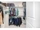 Organized walk-in closet with shelving and hanging space for clothing and accessories at 23652 E 40Th Ave, Aurora, CO 80019