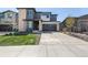 Attractive two-story home with a well-maintained lawn and a spacious two car garage and modern curb appeal at 23652 E 40Th Ave, Aurora, CO 80019