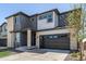 Contemporary two-story home with a stone and siding exterior, and a spacious two car garage at 23652 E 40Th Ave, Aurora, CO 80019