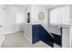 The upstairs hallway features decorative wainscoting and easy access to the home's bedrooms at 23652 E 40Th Ave, Aurora, CO 80019