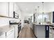 Modern kitchen with granite countertops, stainless steel appliances, and a breakfast bar at 23652 E 40Th Ave, Aurora, CO 80019