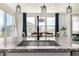 Close up of modern kitchen island with sink and view of the dining area at 23652 E 40Th Ave, Aurora, CO 80019