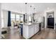 Bright kitchen with an island, stainless steel appliances, and a dining area at 23652 E 40Th Ave, Aurora, CO 80019