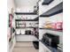 Well-organized pantry with navy shelving, containers and ample storage for kitchen essentials at 23652 E 40Th Ave, Aurora, CO 80019