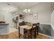 Dining room with hardwood floors and a view to the kitchen at 6021 W Castlegate Dr # E18, Castle Rock, CO 80108