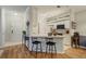 Kitchen with white cabinets, bar seating, and stainless steel appliances at 6021 W Castlegate Dr # E18, Castle Rock, CO 80108