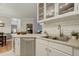 Charming kitchen with stainless steel dishwasher, and ample counter space, seamlessly blending style and functionality at 6021 W Castlegate Dr # E18, Castle Rock, CO 80108