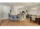 Kitchen with white cabinets, bar seating, and stainless steel appliances at 6021 W Castlegate Dr # E18, Castle Rock, CO 80108