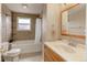 Tiled bathroom featuring a bathtub, shower, and vanity with modern fixtures at 909 E 7Th Ave, Broomfield, CO 80020