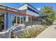 Outdoor seating area in front of a modern brewery with a blue exterior and patio at 1970 S Haleyville Way, Aurora, CO 80018