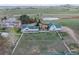 Aerial view showcasing horse property including home, barn, gazebo and fenced pasture at 6231 Prospect Rd, Longmont, CO 80503