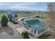 Expansive property showcasing multiple buildings with green roofs, set against a backdrop of rolling fields and distant mountains at 6231 Prospect Rd, Longmont, CO 80503