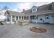Private backyard with stone patio, outdoor kitchen and serene landscaping at 6231 Prospect Rd, Longmont, CO 80503