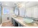 Modern bathroom featuring a double vanity, glass bowl sinks, and walk-in shower at 6231 Prospect Rd, Longmont, CO 80503