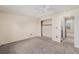 This bedroom offers neutral paint with carpeted floor and a ceiling fan at 6231 Prospect Rd, Longmont, CO 80503