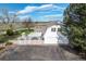 Aerial view of home showcasing fenced yard, garden, pergola and ample parking at 6231 Prospect Rd, Longmont, CO 80503