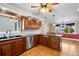 Traditional kitchen featuring wooden cabinets, stainless steel appliances, and tile backsplash at 6231 Prospect Rd, Longmont, CO 80503