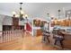 Open-concept kitchen featuring wood cabinetry, granite countertops, stainless steel appliances, and seamless access to the living spaces at 6231 Prospect Rd, Longmont, CO 80503