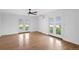 Bright living room featuring white walls, hardwood floors, and outdoor access at 6231 Prospect Rd, Longmont, CO 80503