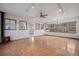 Spacious living room featuring wood floors, abundant natural light, and a cozy fireplace at 6231 Prospect Rd, Longmont, CO 80503